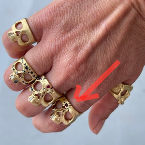 
            
                Load image into Gallery viewer, Wearing the ruby skull ring with snaggletooth by Polly Wales.
            
        