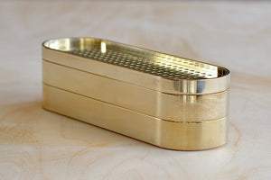 The 001 Stack Burner is a three tiered incense burner in polished brass. The top is a vent, the middle has space for up to three sticks to burn, and the bottom is extra storage. It is as posh as posh gets and we will include a box of our favorite incense. Designed by Populus Project in Canada.