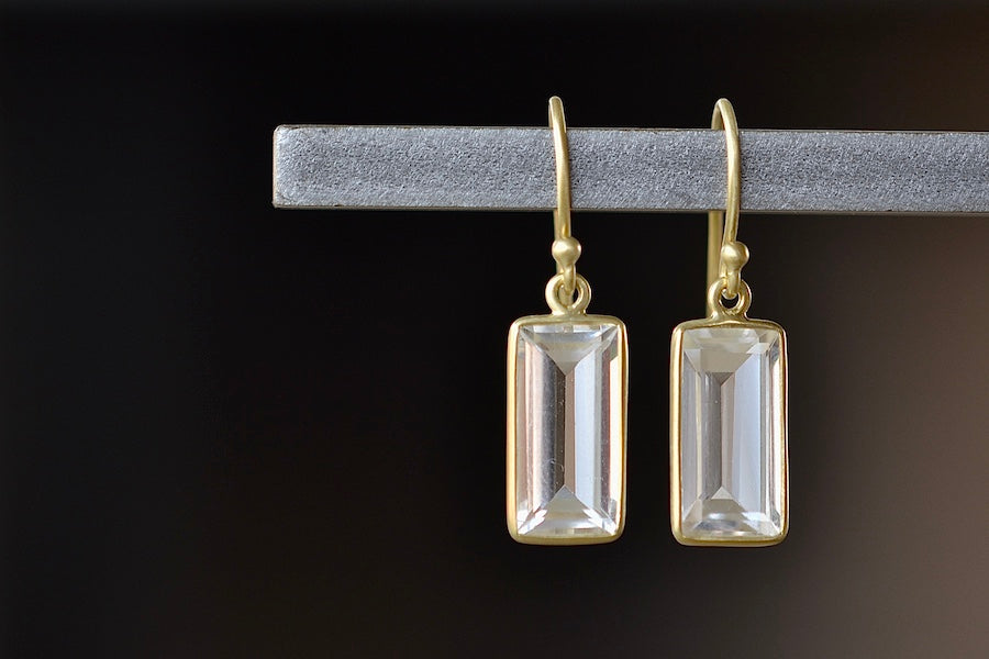 Medium Baguette Earrings in Crystal  by Tej Kothari are Smooth, translucent and rectangular Crystal baguettes set in 18k yellow gold with gold ear wire.