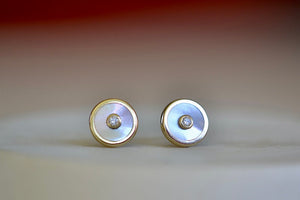 
            
                Load image into Gallery viewer, Compass Stud Earrings by Retrouvai in white mother of pearl, 14k yellow gold and white diamond.
            
        