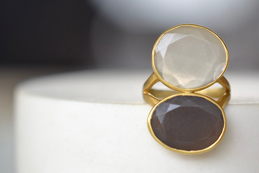 Double Moonstone Greek ring by Pippa Small is made of two organically shaped, lightly faceted, dark grey and white bezel set Moonstones sit one on top of the other.