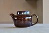 Vintage Arabia Finland "Mahonki" Teapot is a vintage teapot in deep mahogany brown gloss glaze with lid and large infuser in excellent shape.  Designed for Arabia by Ulla Procopé in 1960. Made in Finland. 