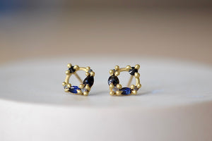 
            
                Load image into Gallery viewer, Polly Wales Des Goutes de Rosee Stud Earrings studs in Midnight Fade 18k Yellow Recycled Gold Blue and black sapphires and white diamonds. 
            
        