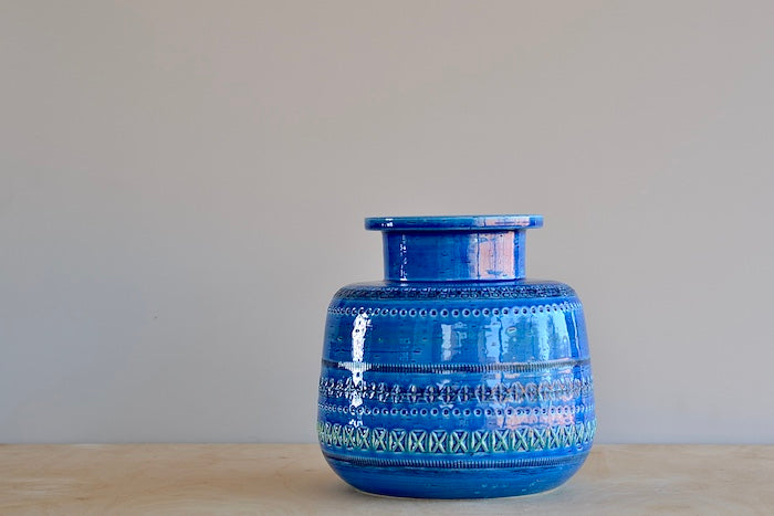 Rimini Blu Rochetto Vase is a ZZ999 Current production of the "Rimini Blu" series. Designed between 1955 and 1965 by by Aldo Londi. This vase is hand made in Italy and one of a kind, made in ceramic earthenware and with a blue glaze.