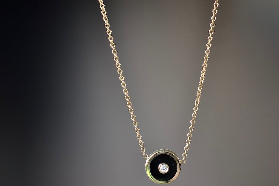 
            
                Load image into Gallery viewer, Mini Compass Pendant Necklace in Black Onyx by Retrouvai with round white diamond accent on 16&amp;quot; 14k yellow gold chain.
            
        