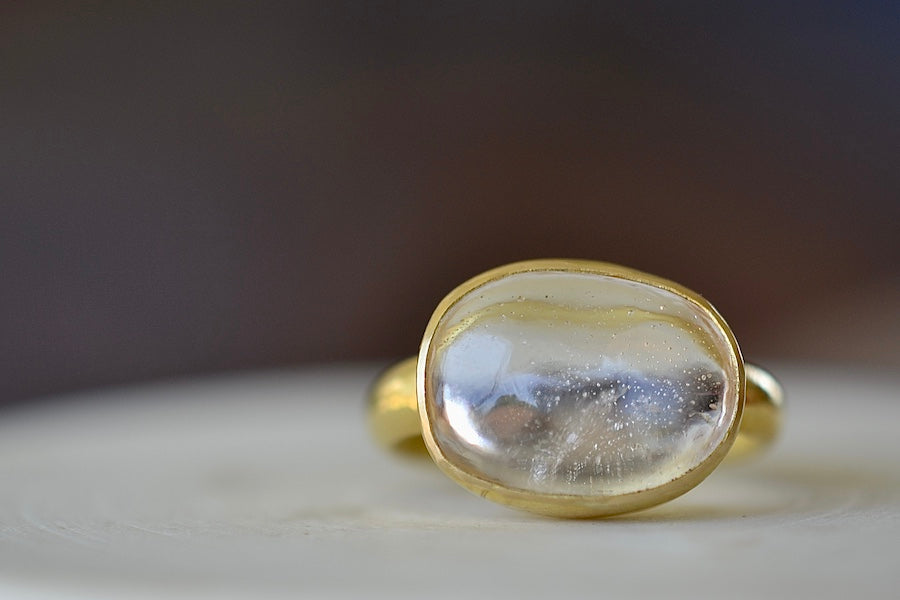 
            
                Load image into Gallery viewer, The Crystal Large Greek ring by Pippa Small is an Organically shaped mostly clear and transparent to translucent crystal with natural inclusions set in 18k yellow gold. 
            
        