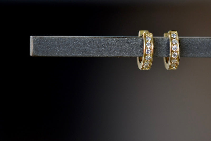 
            
                Load image into Gallery viewer, OK Diamond Huggie Hoops are Six white pavé diamonds set in 14k gold and designed in Los angeles.
            
        
