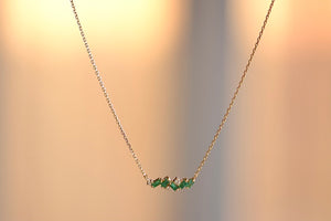 
            
                Load image into Gallery viewer, Suzanne Kalan Mini Emerald Bar Necklace is Five (5) emerald baguettes and three (3) round cut diamonds form a perfectly imperfect bar on an 18k yellow gold chain in 17&amp;quot; or 15&amp;quot; available at OK
            
        