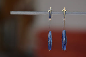 
            
                Load image into Gallery viewer, Lapis and Kyanite on Stick and Strand Earrings by Kathleen Whitaker are One of a kind kyanite stones with natural inclusions that are drilled and prism shaped and attached to Kathleen Whitaker&amp;#39;s signature stick and strand with post closure. Stone collection.
            
        