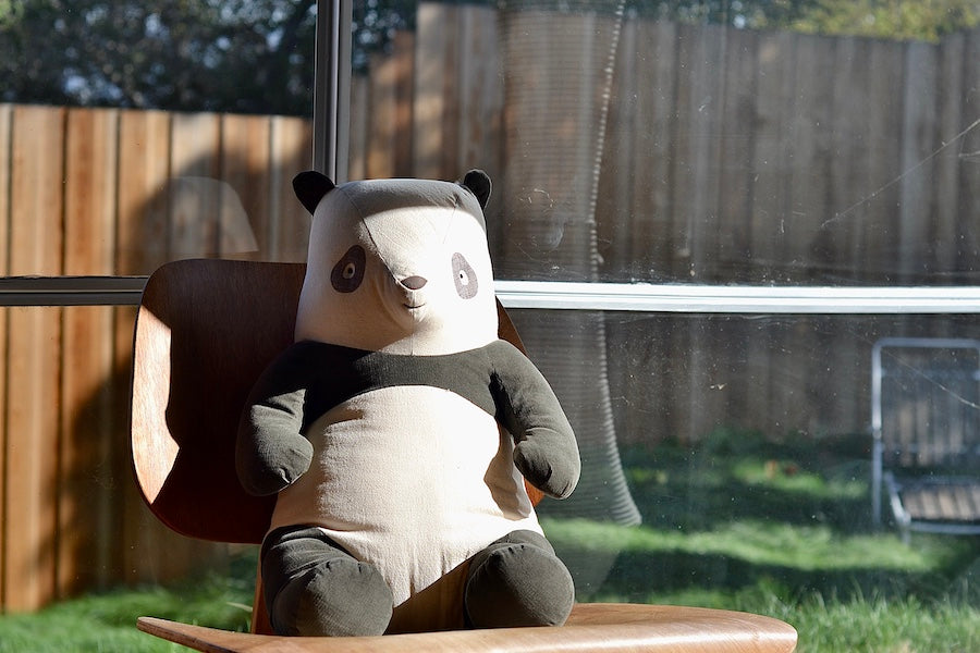Very Large Danish Panda in Cotton by Maileg with ribbed fabric on Eames chair.