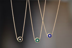 
            
                Load image into Gallery viewer, Mini Compass Pendant Necklace in Blue Lapis by Retrouvai with round white diamond accent on 16&amp;quot; 14k yellow gold chain with Black Onyx and Green Malachite..
            
        