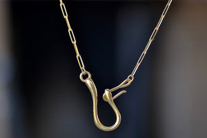 Hook and Catch Leilou Necklace by Meredith Kahn is Inspired by vintage to show off the clasp, her signature "Hook and Catch" double or two hook closure. Her chain necklace is 14k yellow or gold pleated with long and slim Leilou paperclips. It can be worn solo or with a charm or two. Designed in California. Made in New York.