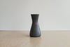 Aubock Vase 7231 called Hourglass in patina brass with polished rim.