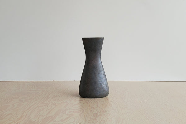 Aubock Vase 7231 called Hourglass in patina brass with polished rim.