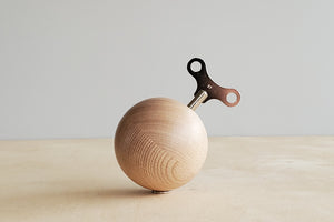 Music Box in wood in the shape of a sphere plays Marriage of Figaro by Mozart.