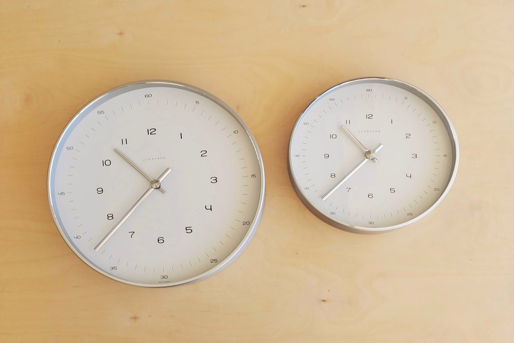 Max Bill Wall Clock by Junghans in two sizes and minimalist design.