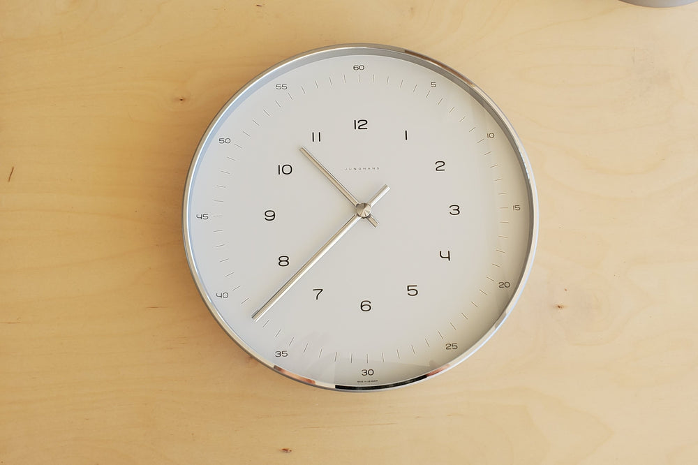 Max Bill Wall Clock by Junghans in two sizes and minimalist design.