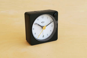 Classic square and analogue Braun Alarm Clock in black.