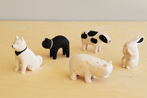 T-lab wooden animals are handmade in Bali from albizia wood, a lightweight fast-growing wood from the South Pacific. A dog, black cat, speckled cow, rabbit and hippo.cow
