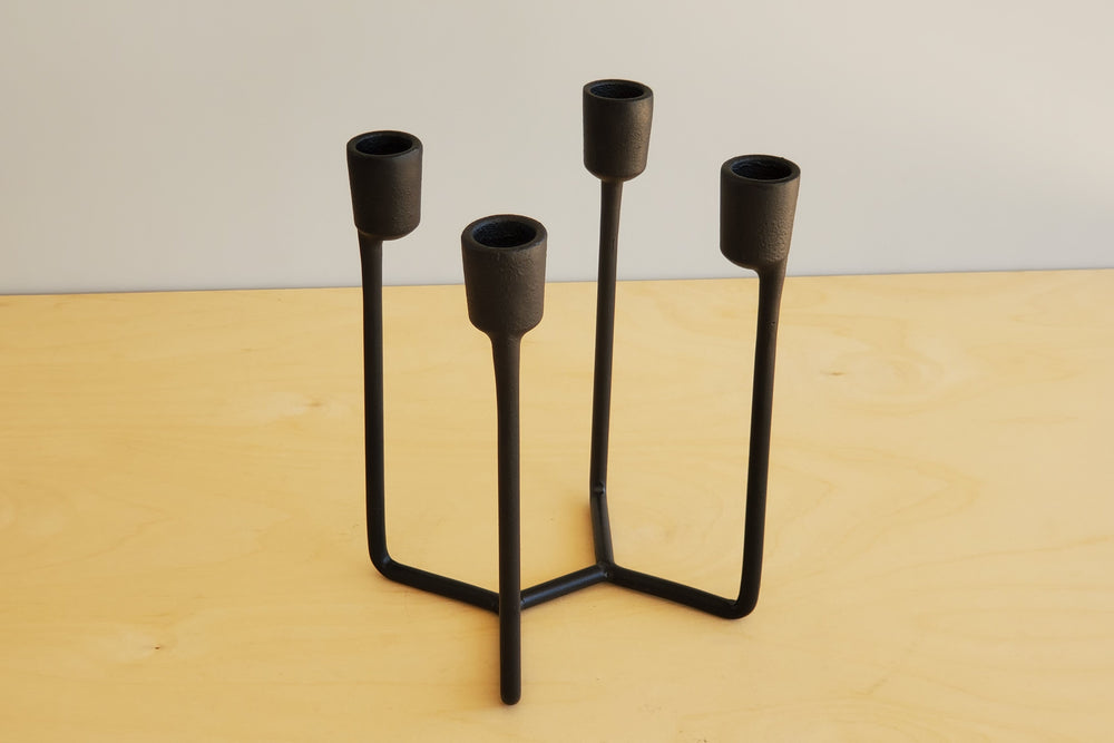 Normann Copenhagen Heima Cast Iron Candle Holder with four (4) arms.