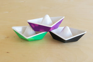 Kid O Color-changing origami boats for bathtub play.