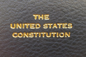 
            
                Load image into Gallery viewer, Close up of Leather Bound United States Constitution from Graphic Image.
            
        