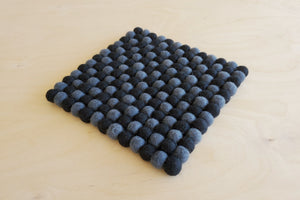 
            
                Load image into Gallery viewer, Wool Felt Pom Pom Trivet from Nepal.
            
        