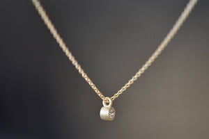 
            
                Load image into Gallery viewer, Dainty Necklace with Diamond by Carla Caruso is a forever necklace of a simple and sparkly white diamond bezel set in 14k yellow gold and satin finish on a chain. Handmade in Massachusetts.
            
        