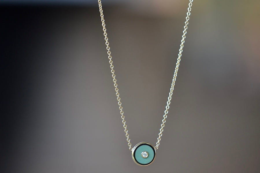 
            
                Load image into Gallery viewer, Mini Compass Pendant Necklace in Green Turquoise by Retrouvai with round white diamond accent on 16&amp;quot; 14k yellow gold chain.
            
        
