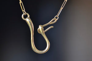 
            
                Load image into Gallery viewer, Hook and Catch Leilou Necklace by Meredith Kahn is Inspired by vintage to show off the clasp, her signature &amp;quot;Hook and Catch&amp;quot; double or two hook closure. Her chain necklace is gold pleated with long and slim Leilou paperclips. It can be worn solo or with a charm or two. Designed in California. Made in New York.
            
        
