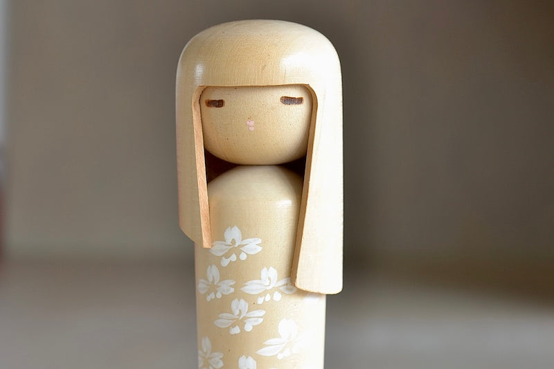 Tall Blonde Vintage Kokeshi doll close up.