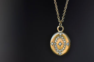 
            
                Load image into Gallery viewer, Day Dream Pendant Necklace is a A small round 18k yellow gold disc with one centered white diamond, a circle of diamonds around it and four more on the edge make a starburst pattern and pendant on an 18k yellow gold chain designed in NY by Adel Chefridi.. 
            
        