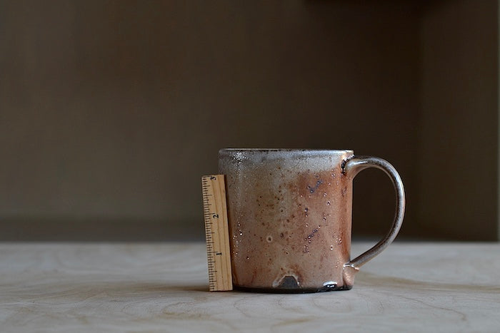 
            
                Load image into Gallery viewer, Size of Wood Fired Mug &amp;quot;C&amp;quot; by Lindsey Oesterritter.
            
        