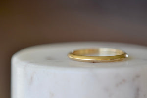 Petite Knife Edge Wedding Band by Lizzie Mandler 1.7mm in 18k yellow gold is handmade in Los Angeles.