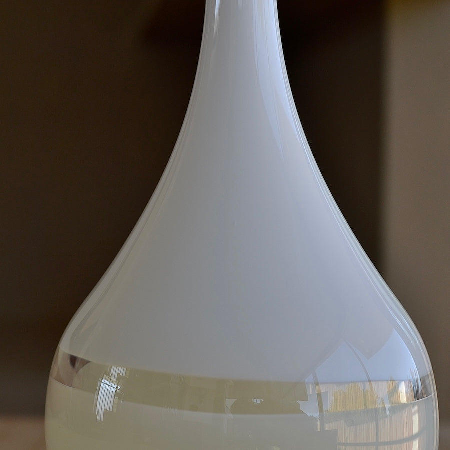
            
                Load image into Gallery viewer, Close up of Lattimo White &amp;amp; Ivory Teardrop Vase Small designed by Caleb Siemon &amp;amp; Salazar, who trained with Pino Signoretto. Italian Milk glass.
            
        
