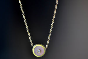 Mini Compass Pendant Necklace in Pink Opal by Retrouvai with round white diamond accent on 16" 14k yellow gold chain.