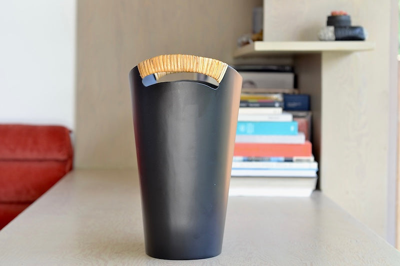 
            
                Load image into Gallery viewer, The Ørskov Wastebasket is made in matte black steel with cane wrapped handles and is 13&amp;quot; tall. It was designed by Grethe Kornerup-Bang in Denmark and is still  produced by Torben Orskow.
            
        