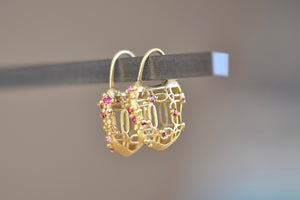 
            
                Load image into Gallery viewer, Polly Wales Coeur de Dentelle Padlock Earrings 18k yellow gold filagree padlock earrings with rich pink sapphires and a matte finish. Hinged ear wire closure
            
        