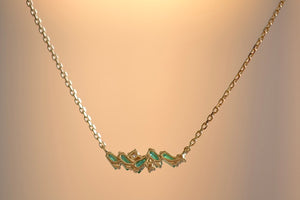
            
                Load image into Gallery viewer, Suzanne Kalan Mini Emerald Bar Necklace is Five (5) emerald baguettes and three (3) round cut diamonds form a perfectly imperfect bar on an 18k yellow gold chain in 17&amp;quot; or 15&amp;quot; available at OK
            
        