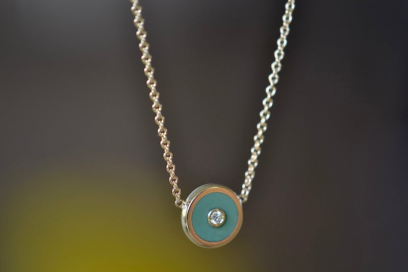 Side view of Mini Compass Pendant in Green Turquoise by Retrouvai.
