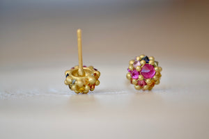 
            
                Load image into Gallery viewer, Polly Wales Small Sputnik Stud Earrings in Rainbow are domed half spheres in 18k yellow gold with encrusted and inverted red, pink, blue, green, yellow and orange sapphires around the circumference with post closure. Cast not set. Recycled Gold.
            
        