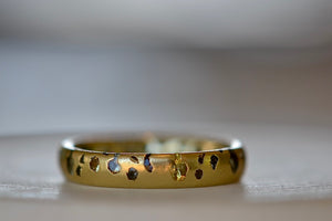 Alternate view of Polly Wales Green Sapphire Confetti Band in size 6 and in 18k yellow recycled gold.