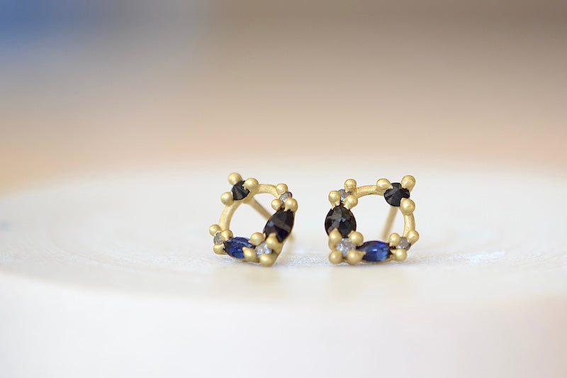Polly Wales Des Goutes de Rosee Stud Earrings studs in Midnight Fade 18k Yellow Recycled Gold Blue and black sapphires and white diamonds. 