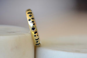 
            
                Load image into Gallery viewer, The Black Sapphire Confetti Band in size 8 designed by Polly Wales is a narrow 18k gold wedding band/ring speckled with black sapphires around the circumference. Cast not set. Made in Los Angeles. 
            
        