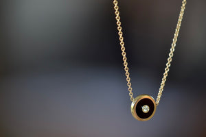 
            
                Load image into Gallery viewer, Side view of Mini Compass in Black Onyx by Retrouvai.
            
        