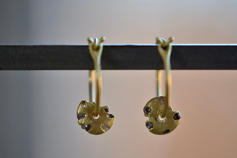 
            
                Load image into Gallery viewer, Polly Wales Diamond Spinner Small Hinge closure Hoop Earrings  are A hinge lock hoop in 18k gold with an attached disc, speckled with mixed diamonds around the circumference for a beautiful confetti-like appearance. Recycled gold.
            
        