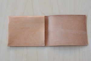 Simple Flap wallet in Natural leather and natural stitching from architect Alice Park shown open.