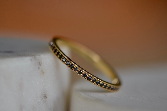 
            
                Load image into Gallery viewer, Othello Stackable Ring Eternity Band by Lizzie Mandler which is a classic eternity band with beautiful diamond pave, half in black and half in white. Handcrafted in Los Angeles.
            
        