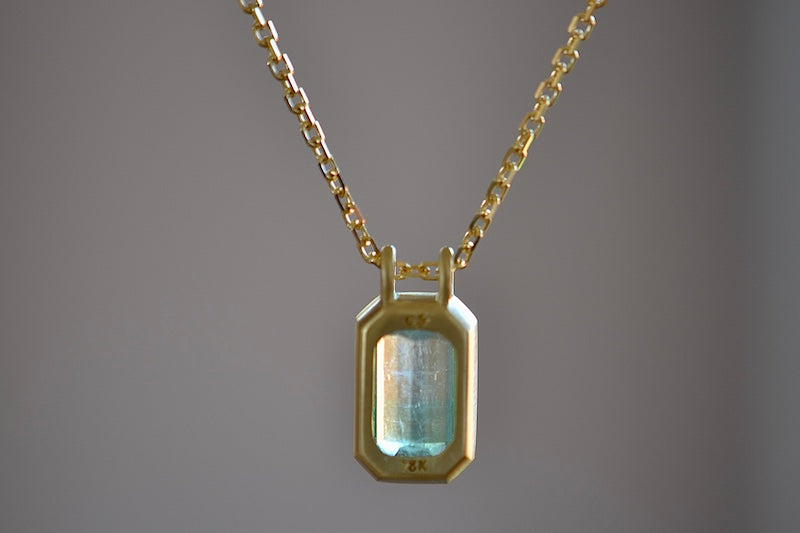 Back of The Duo Bale Emerald Pendant Necklace by Elizabeth Street Jewelry.