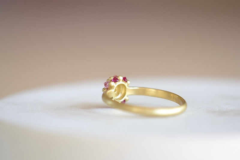 Small Sputnik Ring by Polly Wales is a domed half sphere in 18k yellow gold with encrusted and inverted pink and fuchsia sapphires around the circumference on a 1.5mm gold halo band is a smaller version of the original Sputnik signet or pinky ring. Recycled gold. Cast not set. Handcrafted and handmade in Los Angeles.